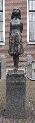 statue of Anne Frank outside the house where she hid: click to enter the Anne Frank house website