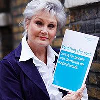 Angela Rippon holding 'Counting the Cost' - click to read more